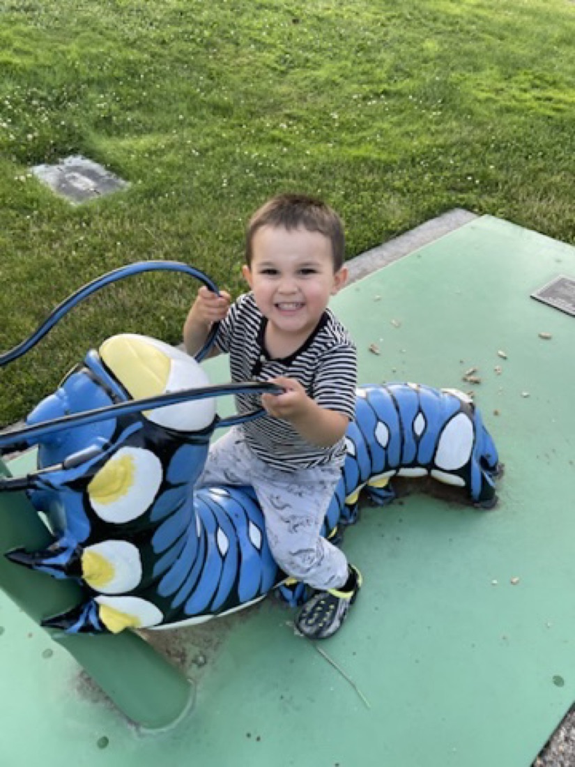 Jody's son riding the caterpillar at Covington Community Park