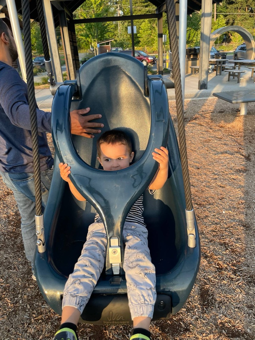 Jody's son on the accessible swing at Covington Community Park