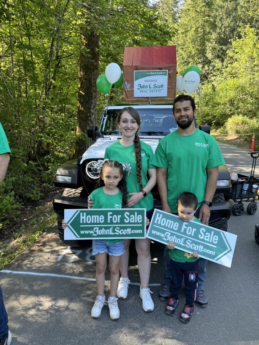 Jody and her family in John L. Scott shirts at the Maple Valley Days parade